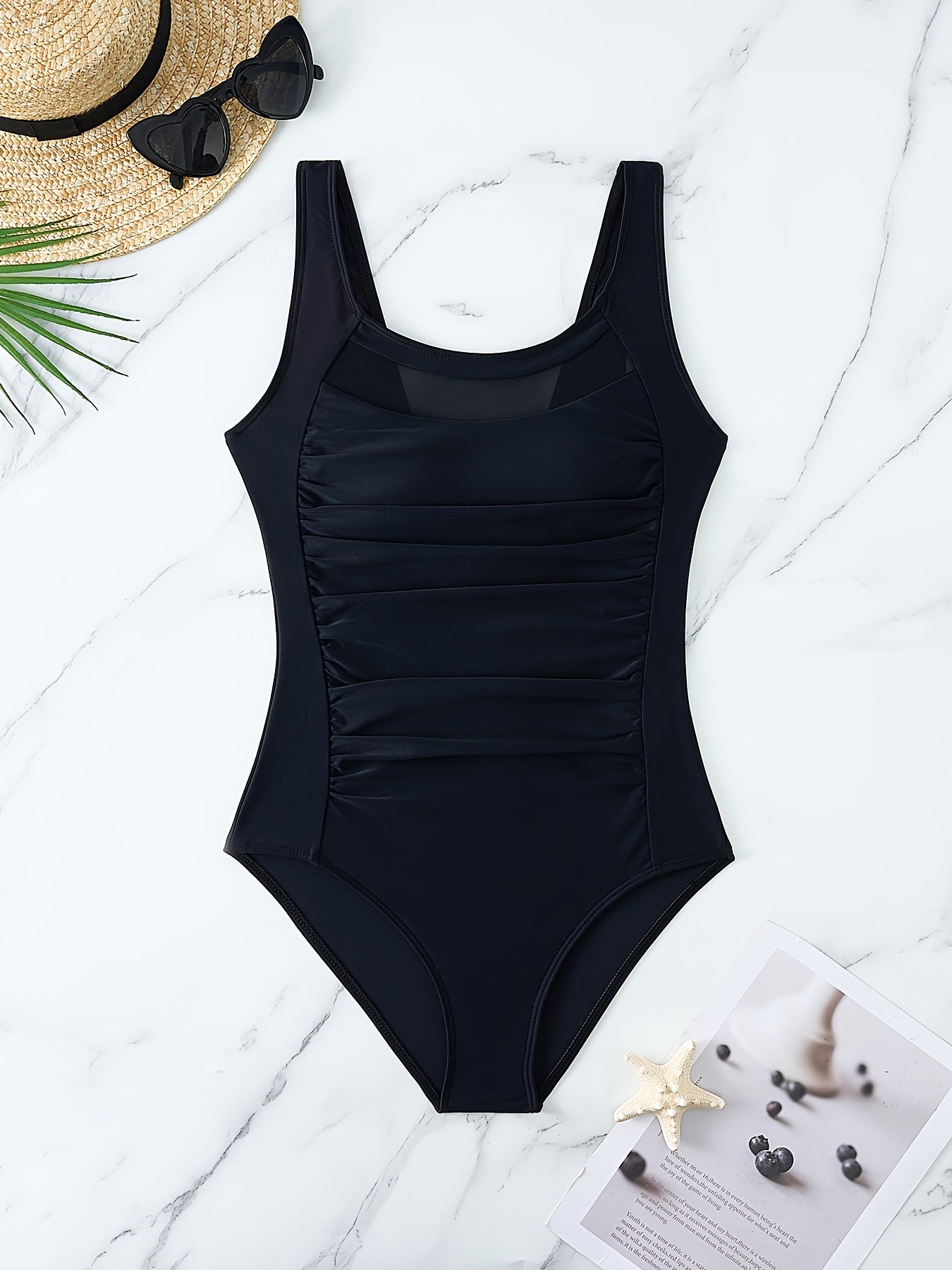 Mesh one-piece swimsuit with round neck and tummy control for women.