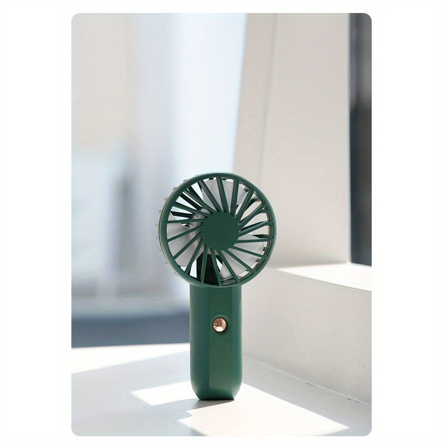 A set of two handheld mini fans that can be worn, USB rechargeable for portability, made of plastic with button control and cord accessory. Each fan has 2.4W power and a built-in lithium battery, perfect for use indoors or outdoors.