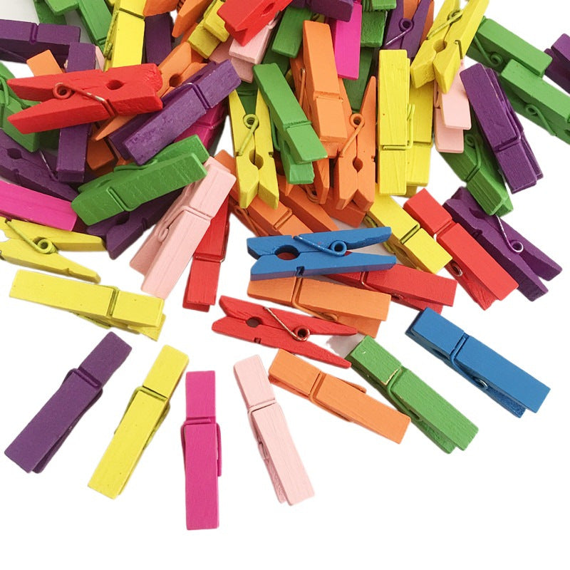 50 colorful wooden clips for DIY photo storage and crafts.