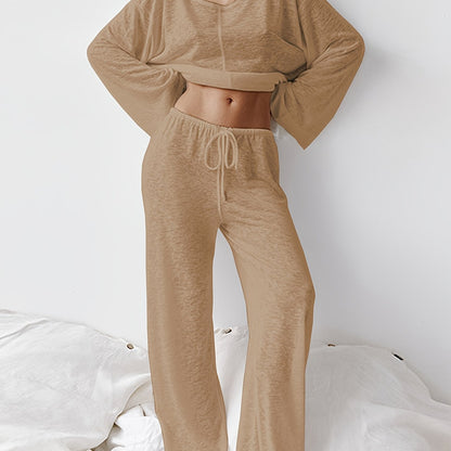 Women's two-piece set of loose and comfortable home clothes made with micro-permeable fabric, featuring round neck and long sleeves.