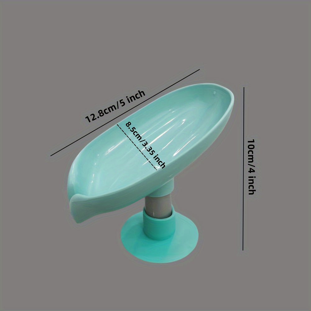 Plastic oval soap dish with suction cup design for home use.