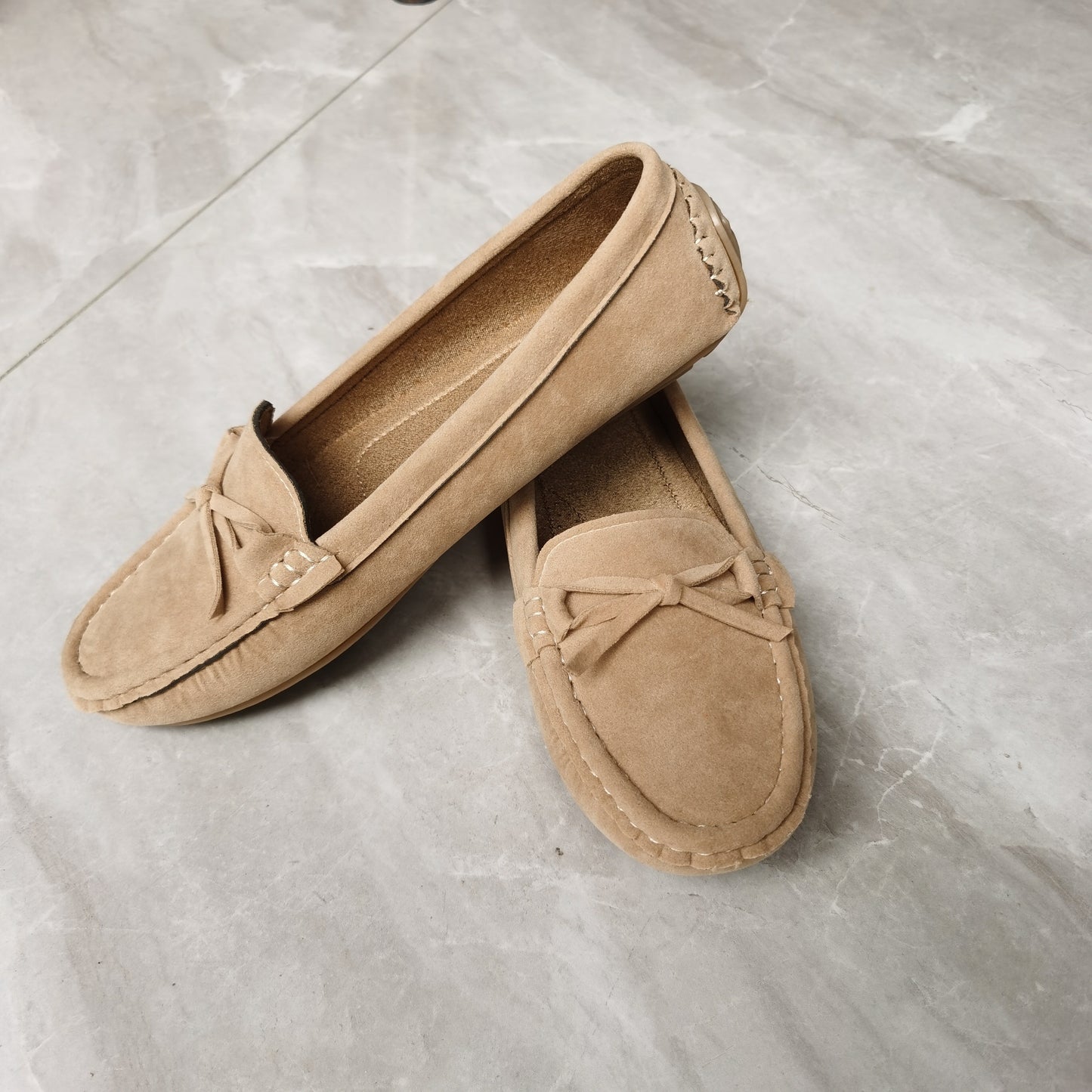 Retro flat loafers with bow detail, slip on style, and soft sole for casual wear.