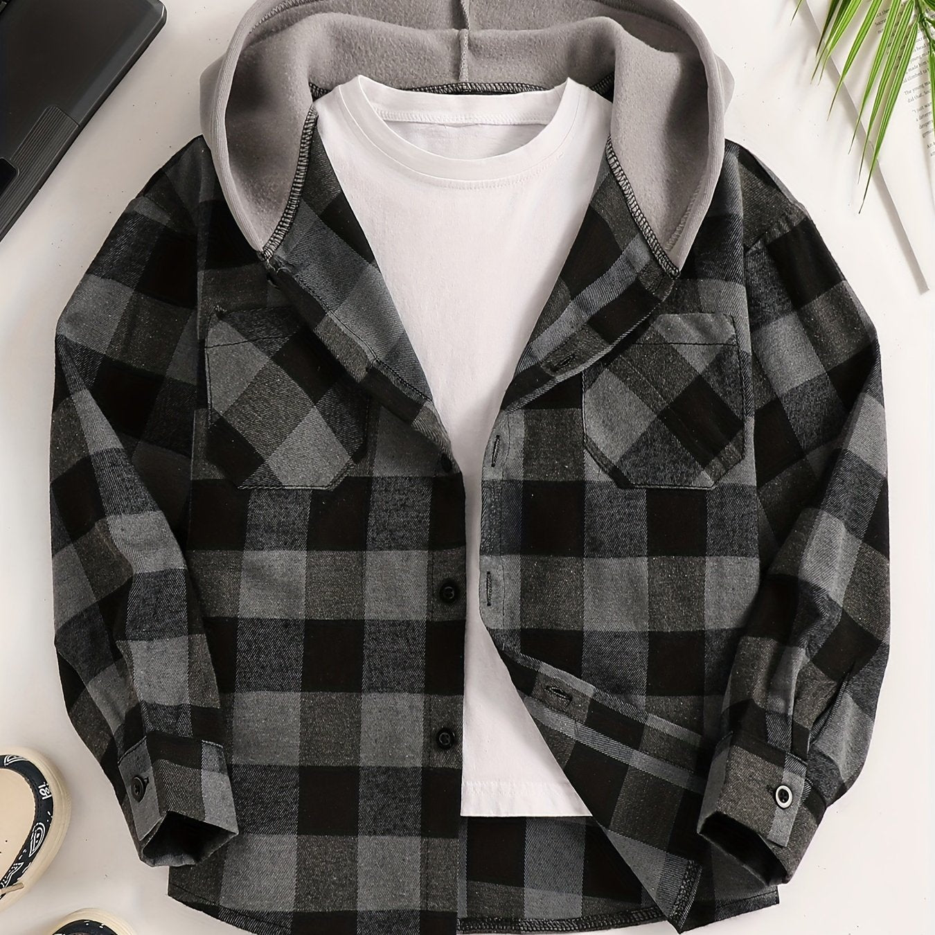 Boys' plaid hooded shirt in blue and black with flap pockets, made of cozy polyester for fall/winter casual wear.