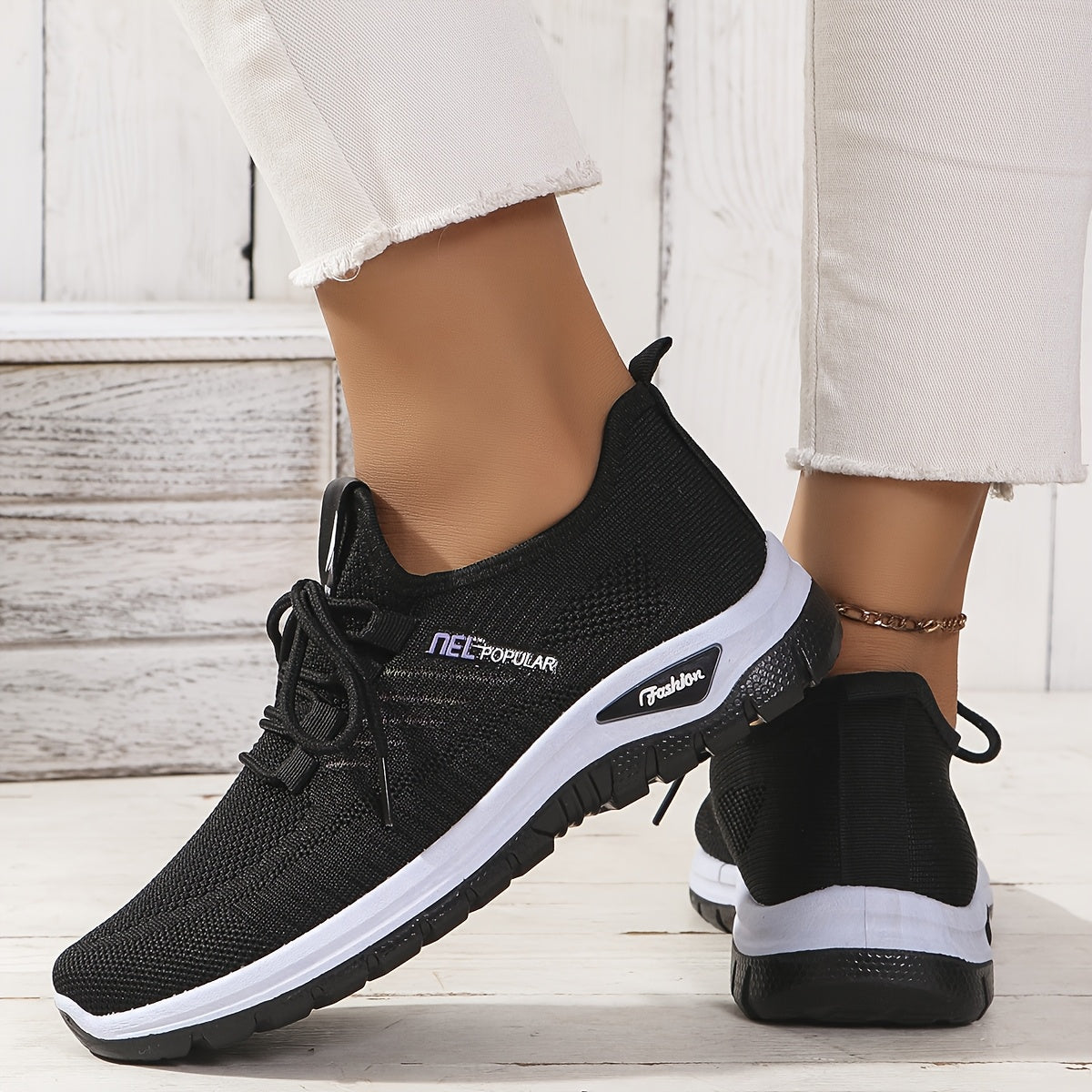 Black knit mesh sneakers with lace-up closure, dual-layer sole, and easy slip-on design for daily commute and outdoor activities. Sleek, breathable and perfect for daily wear.