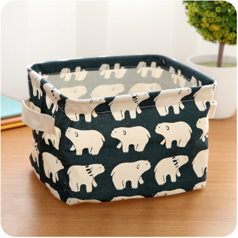 Waterproof desktop storage box made of printed cotton and linen with handle, suitable for organizing sundries.