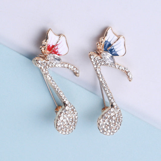 SKEDS Elegant Rhinestone Music Note Butterfly Brooch: Unique Fashion Pin for Both Women and Men