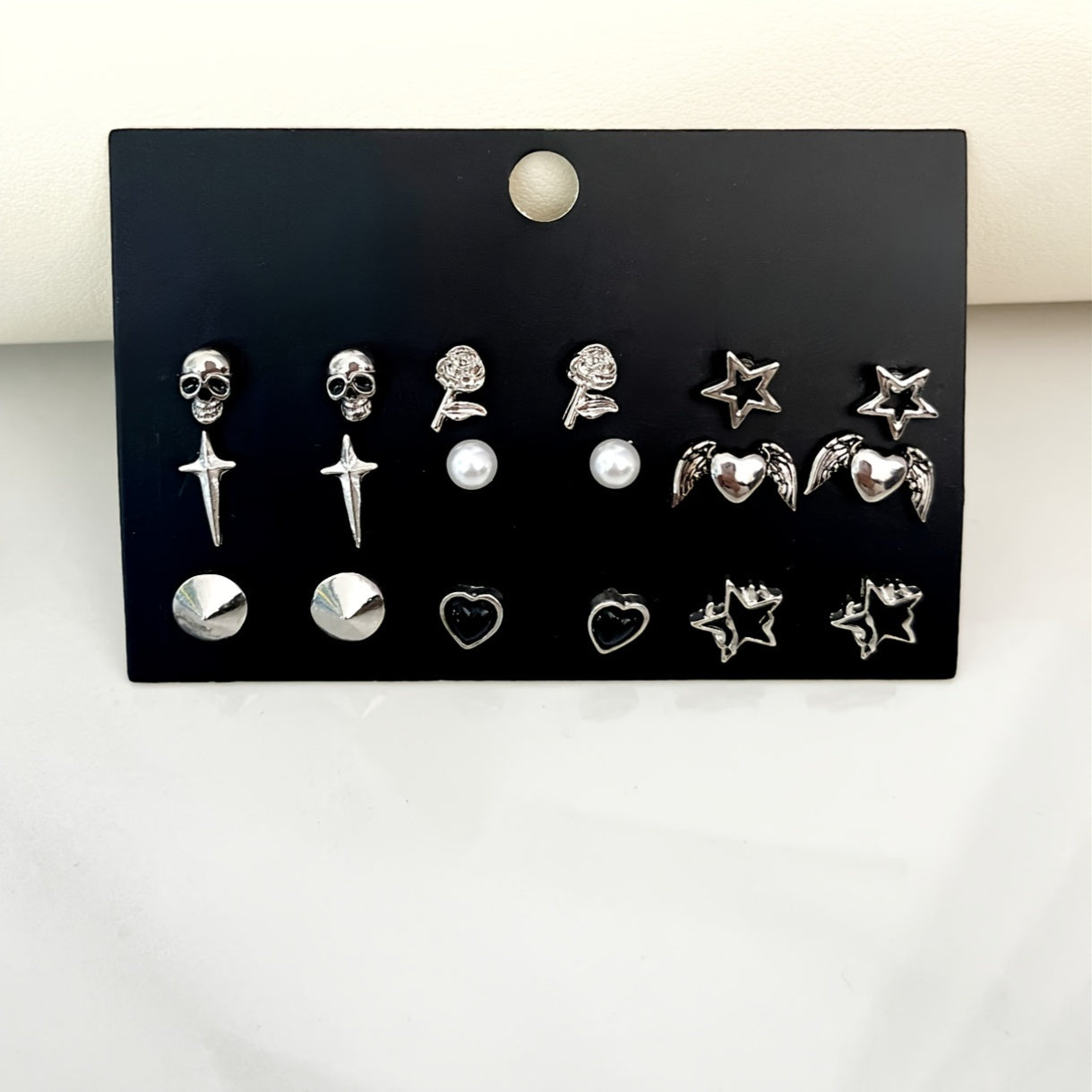 Vintage Gothic Earrings Set featuring 9 pairs, with designs inspired by skulls, roses, stars, hearts, and wings made from zinc alloy. Perfect for daily wear or parties, these earrings are a high aesthetic addition to any outfit. Makes a great Valentine's