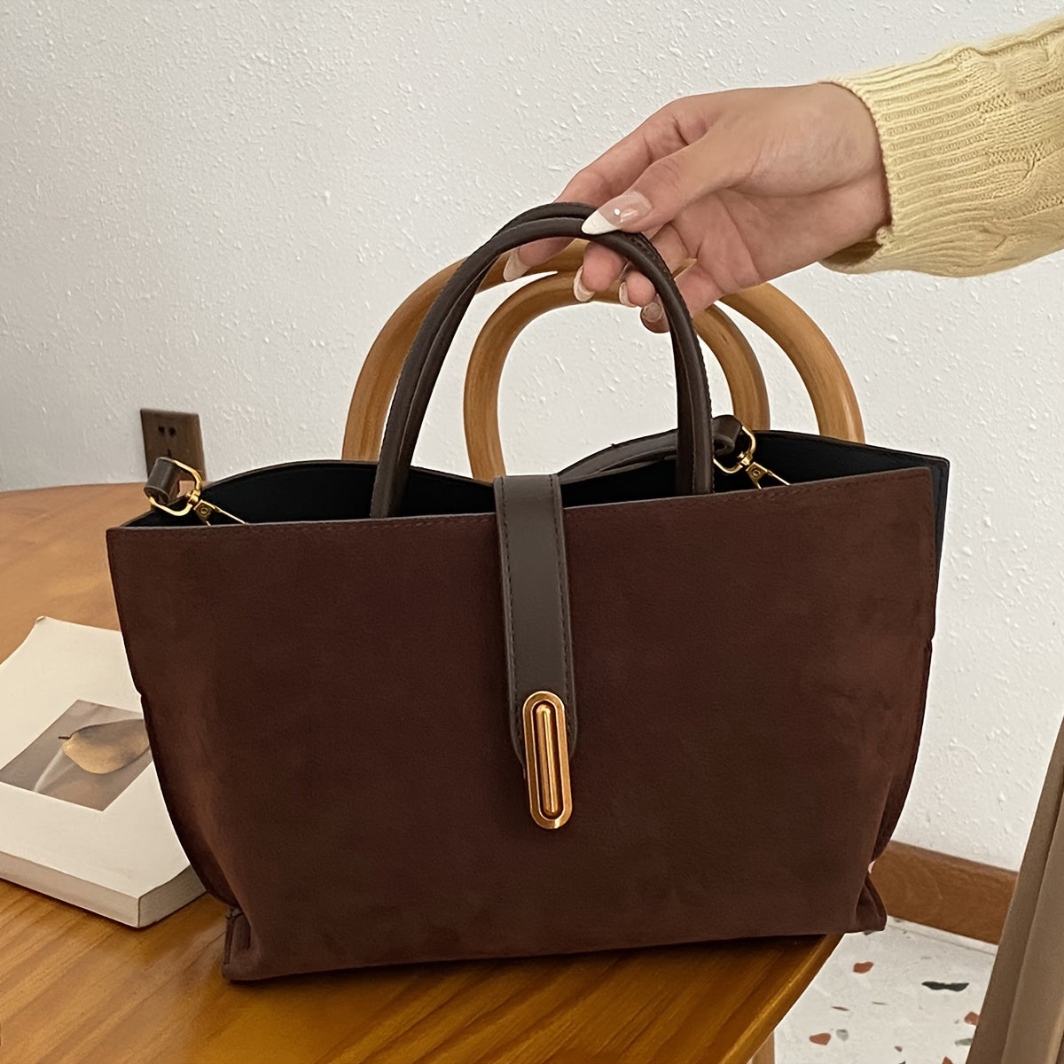 Adjustable shoulder strap tote bag with vintage style and retro large capacity, made from suede leather. Features turn lock closure and unlined fabric material.