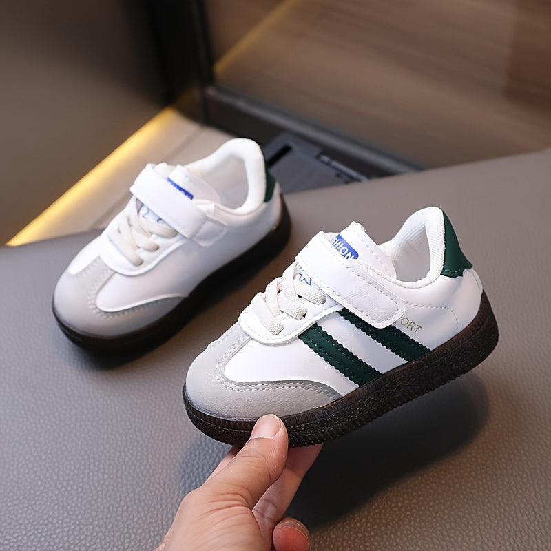 Minimalist unisex toddler sneakers with solid color, adjustable strap closure, slip-resistant sole, and breathable fabric.