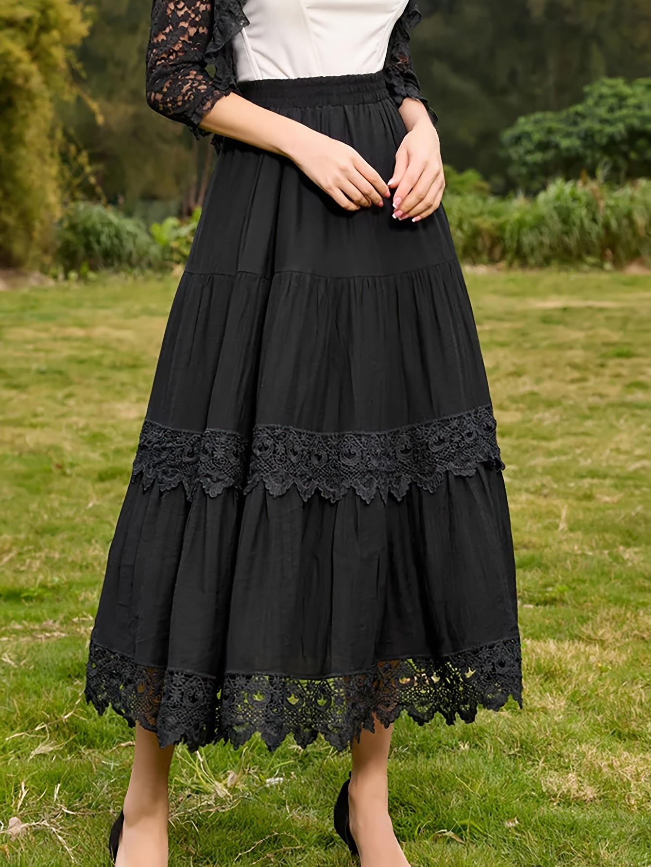 Plus size tiered skirt with lace detail, polyester, a-line, long, elastic waist, solid color, loose fit for all seasons.