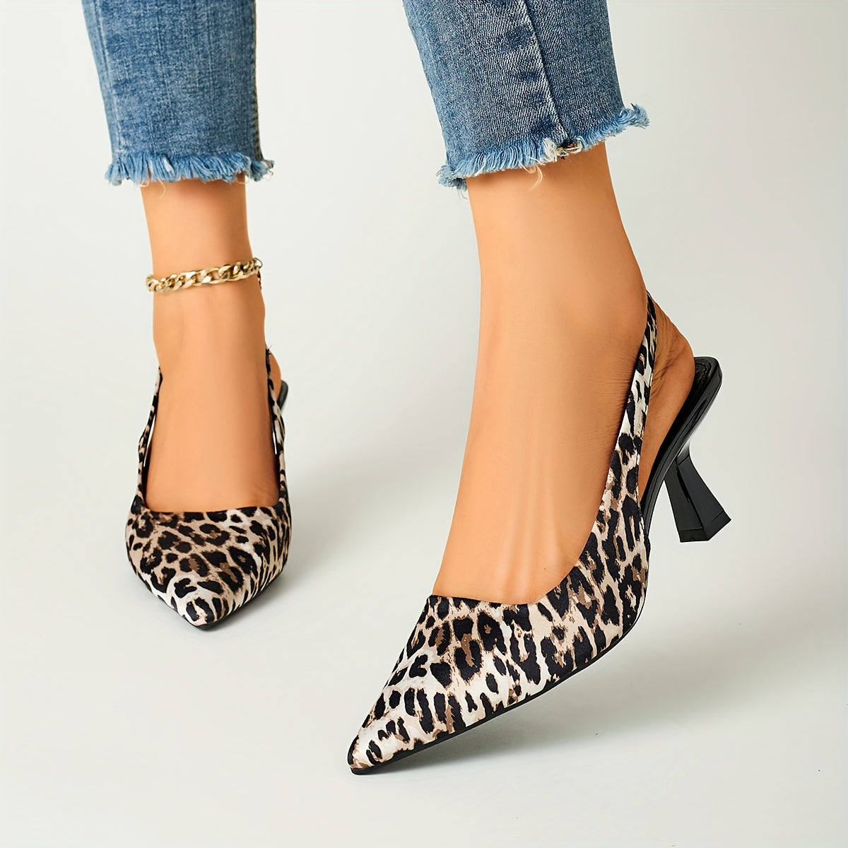 Leopard print stiletto sandals with pointed toe, slip-on style, and high heels in black and brown animal pattern. Comfortable for fall fashion.