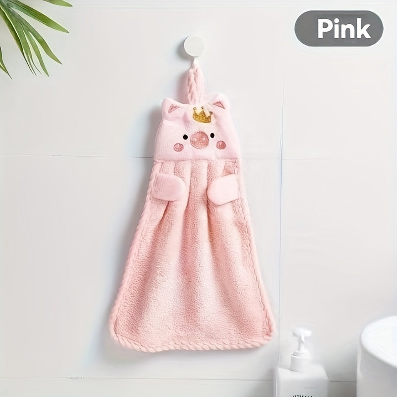 Absorbent hand towel with non-shedding cartoon pig design, made of coral velvet. Perfect for kitchen, bathroom, and living room use.