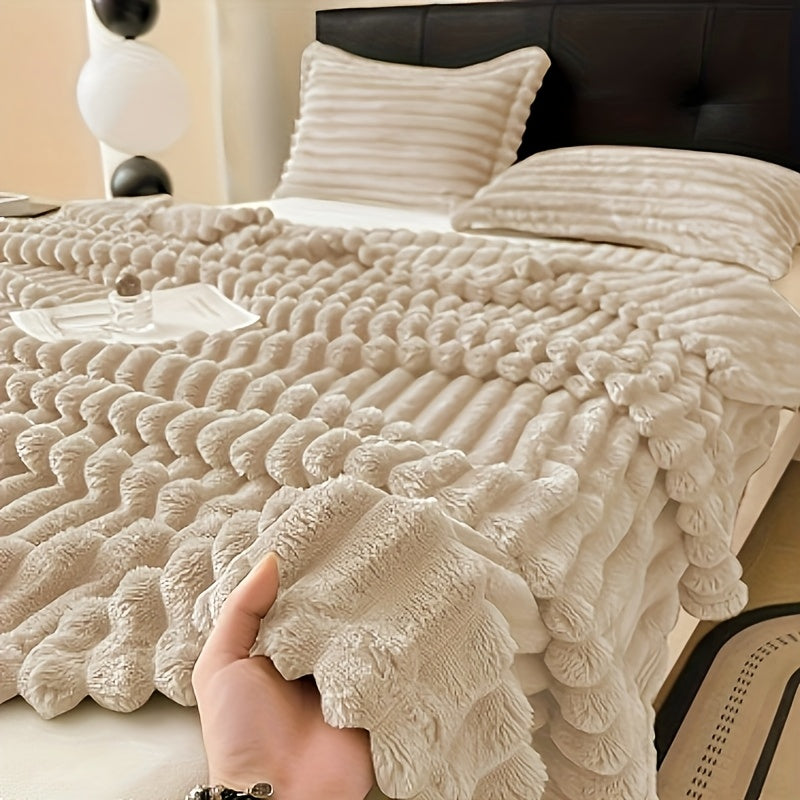 Soft, warm, and luxurious, this contemporary double-sided faux rabbit fur throw blanket is perfect for cuddling up on the couch or bed. Made of polyester knit, it is machine washable for easy care. Whether you're at home or on the go, this all-season