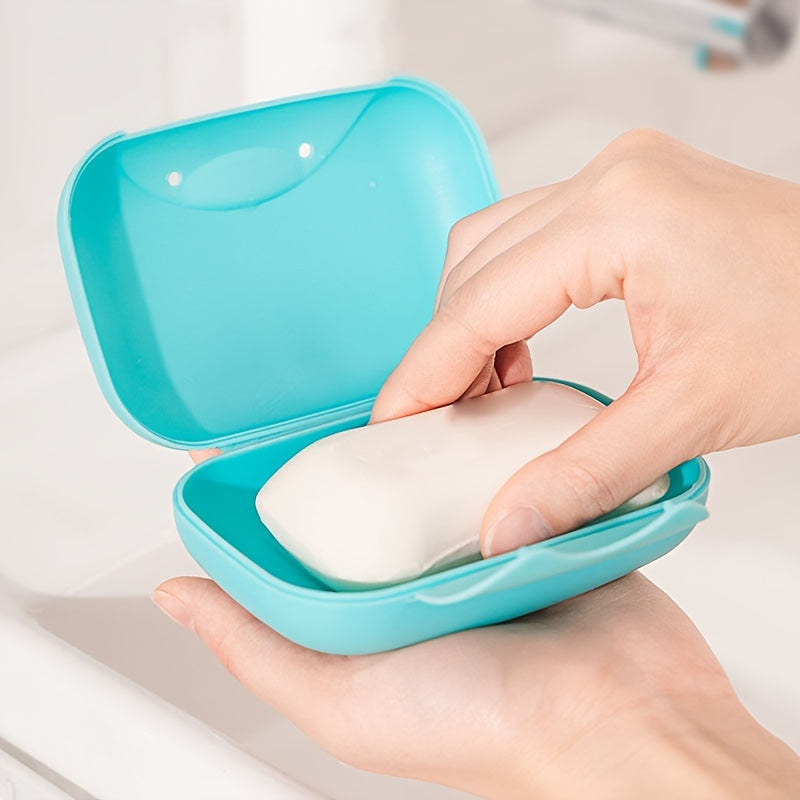 Plastic soap box with lid for travel, camping, or gym use. Waterproof and portable. Perfect for storing soap on the go.