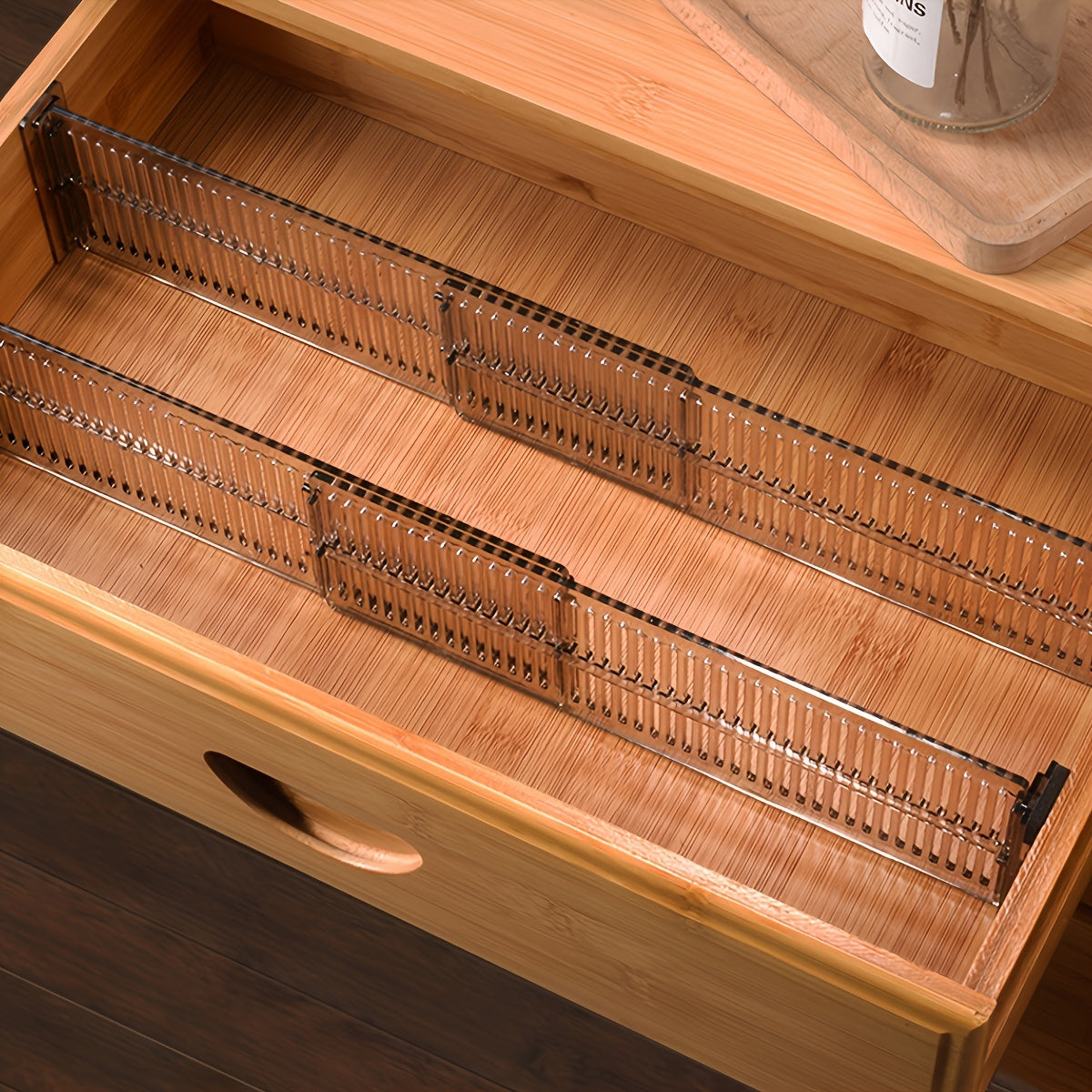 8 adjustable drawer dividers for organizing underwear and socks. Made of durable plastic with expandable grids.