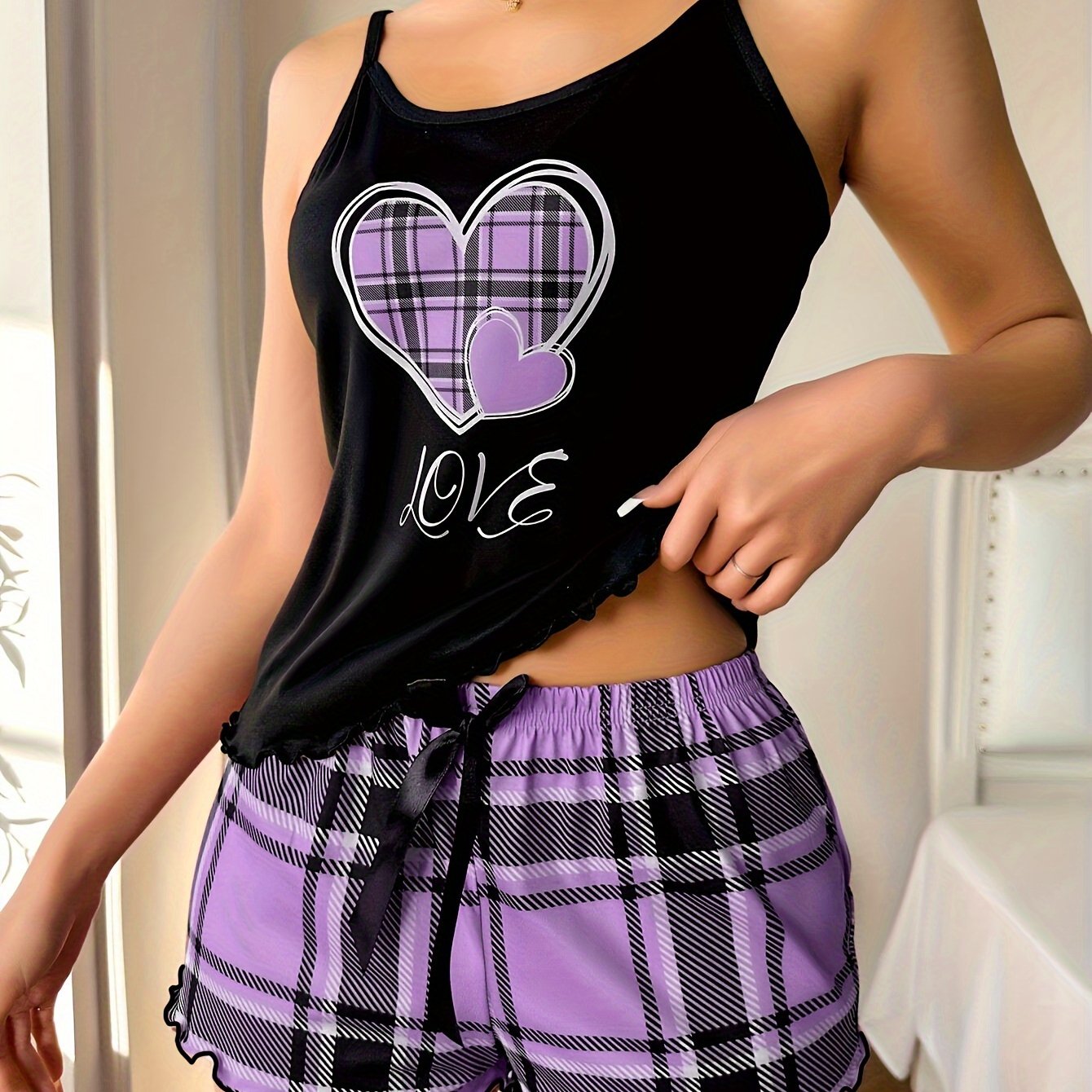 Women's cozy plaid heart pajama set with frill trim, cami top, and shorts for a relaxed summer nightwear look