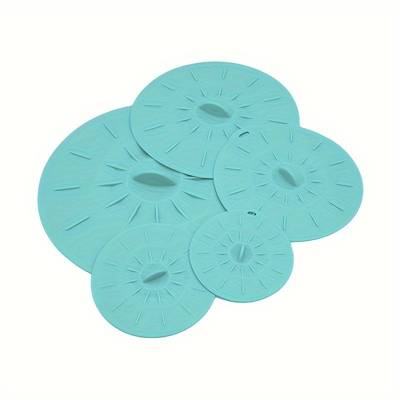 A collection of 5 durable silicone lids that are perfect for covering bowls, cups, plates, pots, pans, and more. These versatile covers can be used in the microwave, stovetop, oven, fridge, and freezer. They are BPA-free and come in various sizes to suit