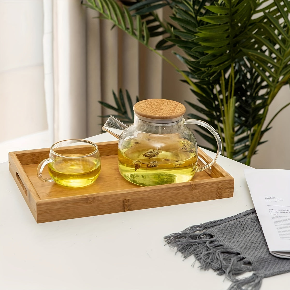 Bamboo serving tray with handles for eating, working, and storing in various locations.