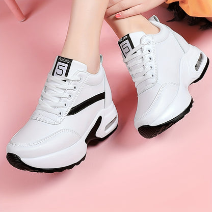 Chunky lace-up sneakers with air cushion for outdoor walks feature hidden heel for added fashion.