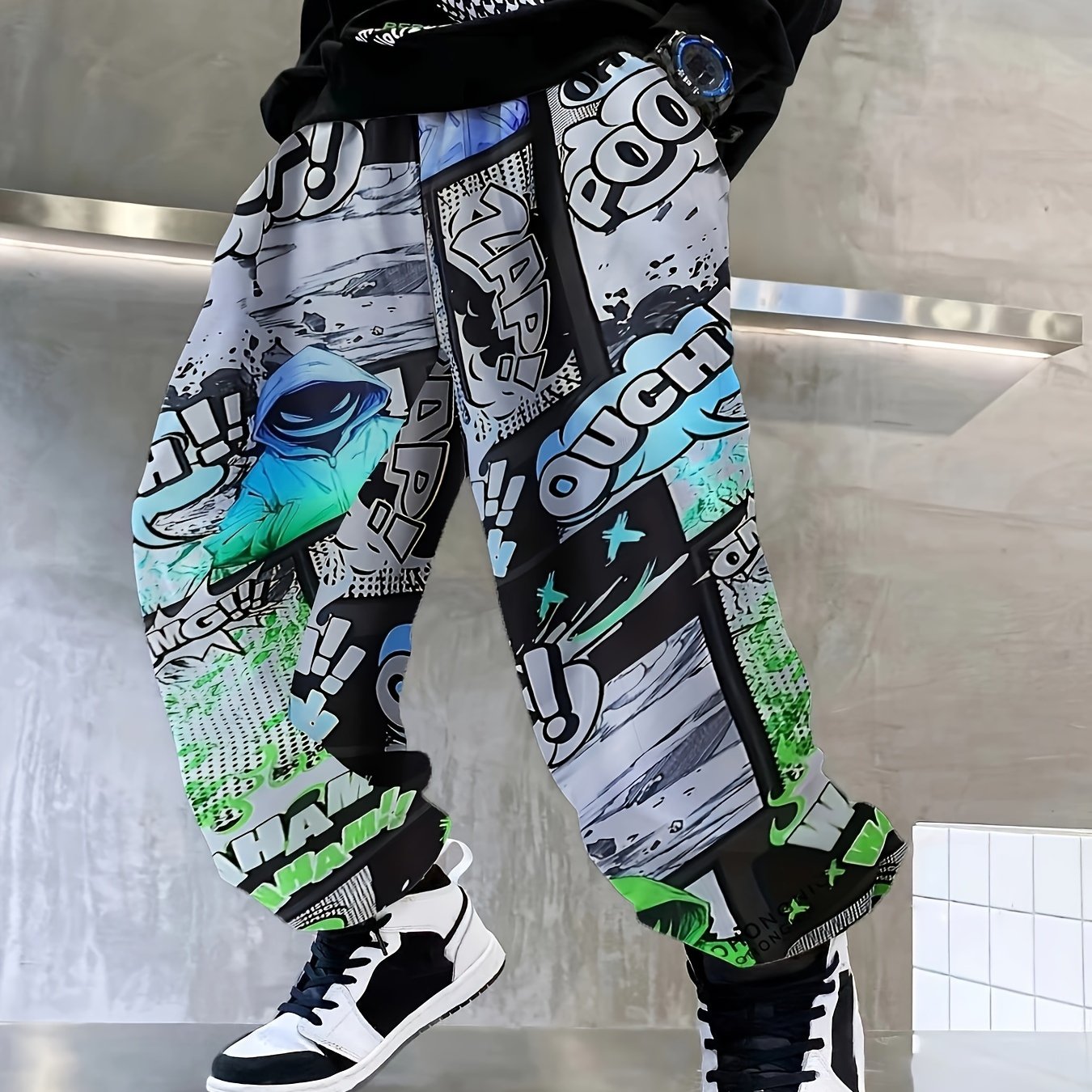 Comfy boys joggers with graffiti and ink splashes, elastic waist.