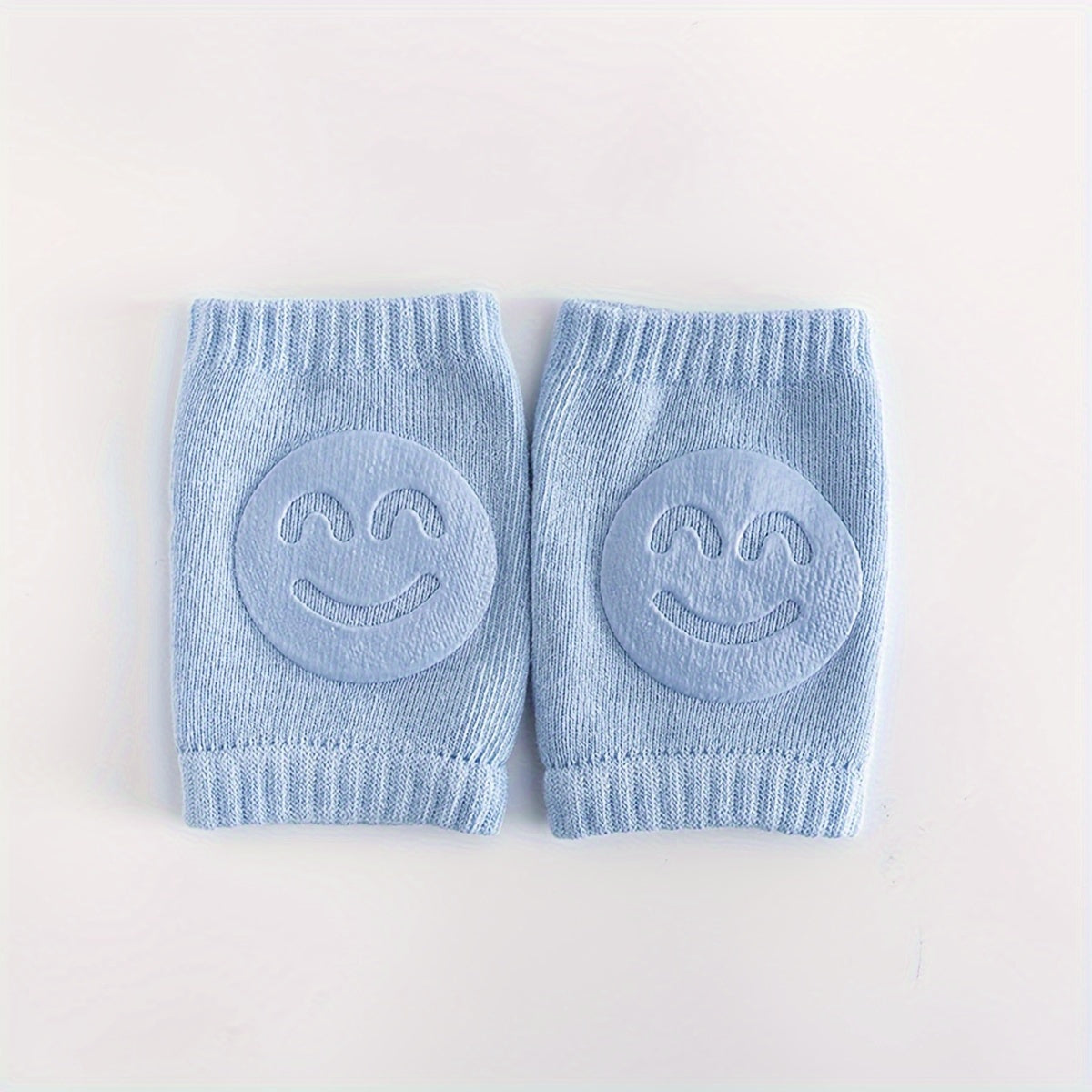 Two pairs of knee pads for toddlers to use while crawling, made from non-slip, phthalate-free polyester material. These elbow and knee protectors are designed for children aged 0-3 years old, providing safety for early walkers with a cheerful happy face