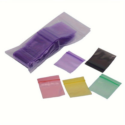 100 pieces of storage bags, featuring double-sided 10 silk thickened self-sealing bags. These reusable small packaging bags measure at 4*4.5cm/1.57*1.77inch and are perfect for storing keys, buttons, pills, and small items. Ideal for kitchen organizers