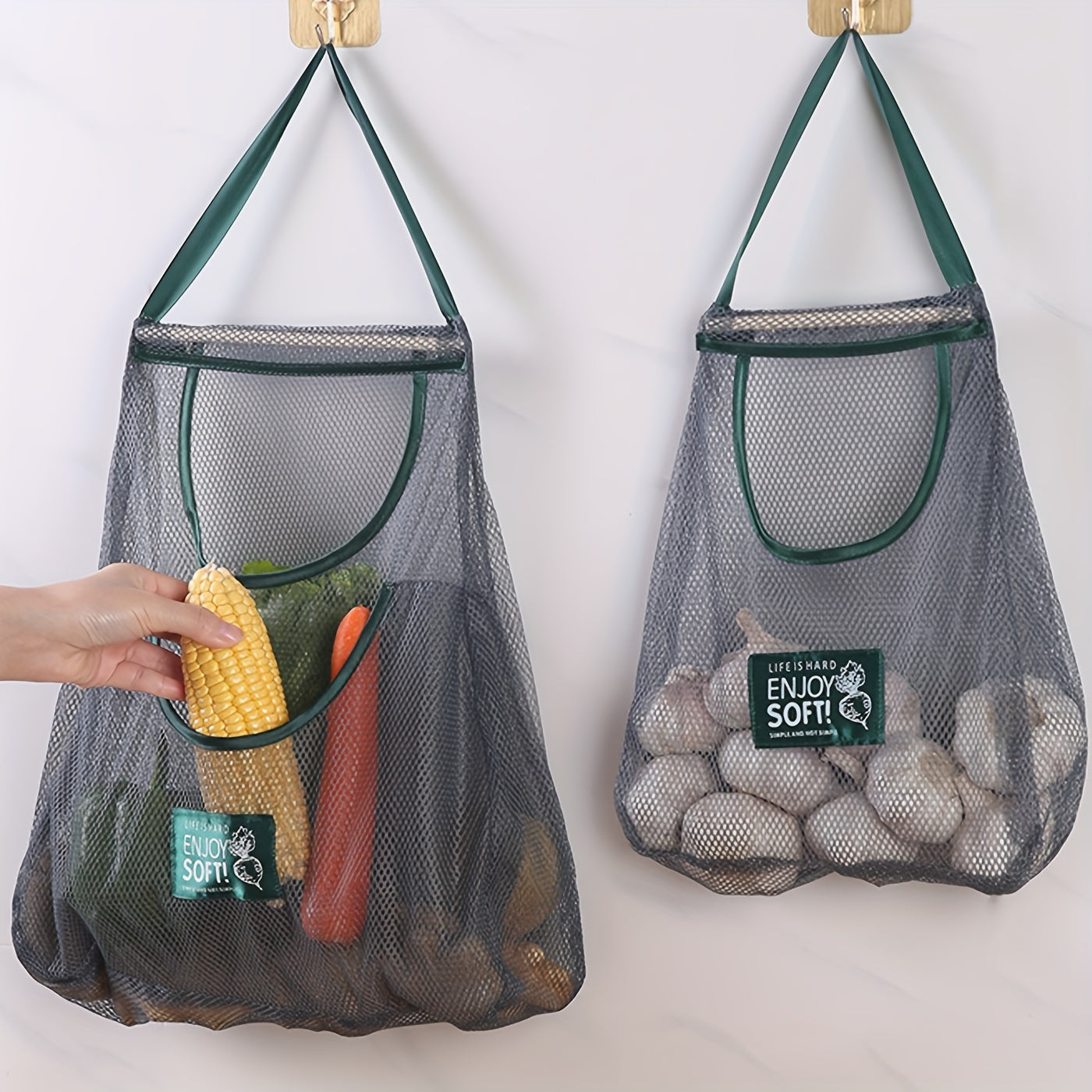 One piece of a mesh hanging bag ideal for storing a variety of items, including garlic, ginger, onion, fruits, and vegetables. This breathable and hangable bag is a versatile storage solution for your kitchen supplies.