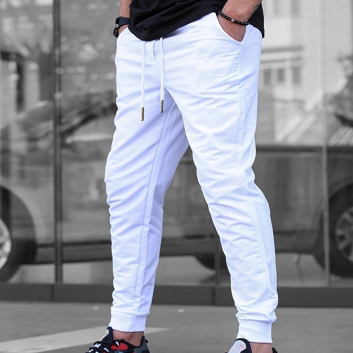 Solid color jogger pants for men with drawstrings, lightweight and breathable for running and fitness.