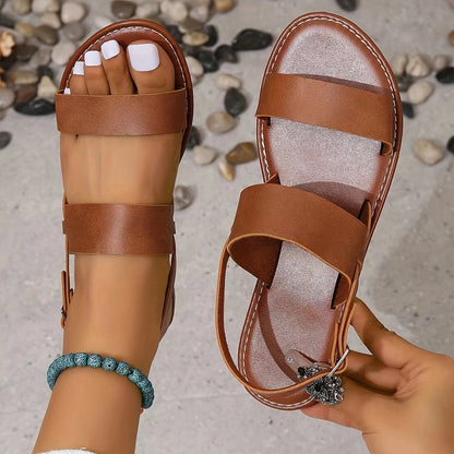 Womens solid color flat sandals with open toe, ankle buckle strap, slingback, non-slip sole, and comfortable design.