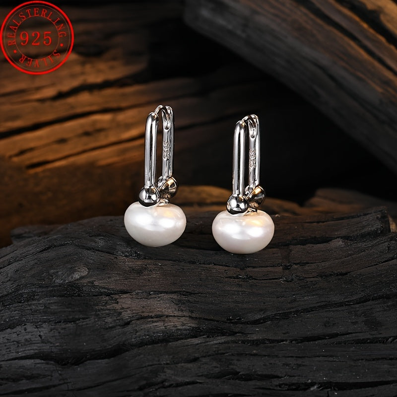 High quality and hypoallergenic jewelry made with 925 sterling silver dangle earrings featuring inlaid freshwater pearls. Perfect for daily outfits or party accessories.