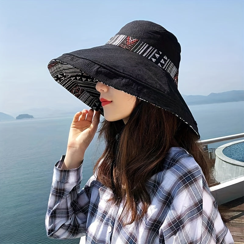 Reversible wide brim cotton bucket hat for women in dark blue with geometric pattern and multicolor accents. Great for travel and outdoor activities. Provides UV protection and