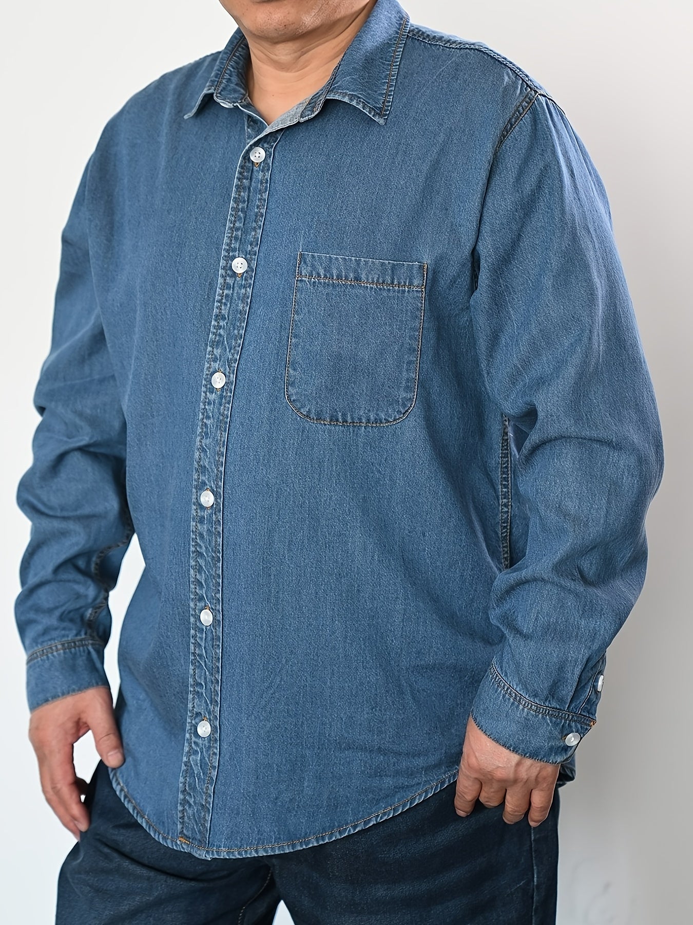 Men's plus size denim shirt, perfect for outdoor activities in spring and fall. Stylish, loose fit and breathable.