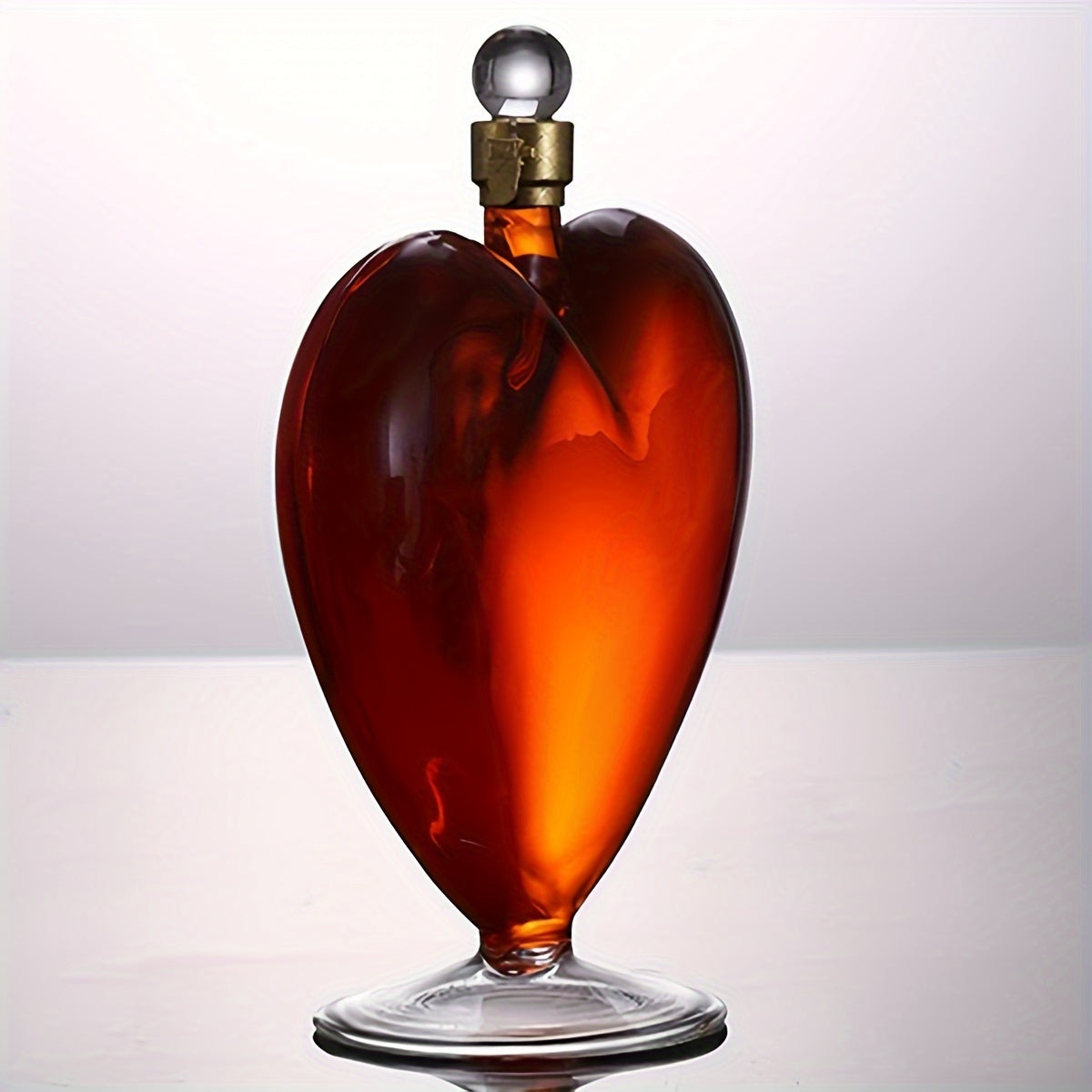 Stylish heart-shaped glass wine decanter, ideal for Valentine's Day and holiday gifts.