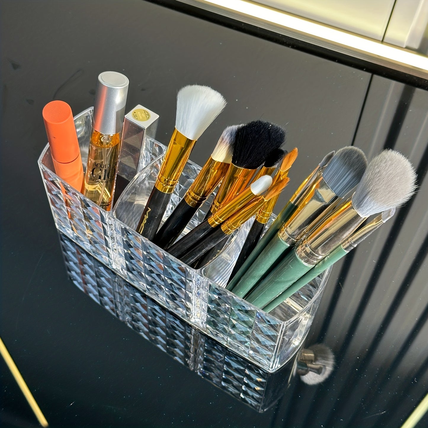 Premium acrylic makeup brush holder with 3 compartments for organizing brushes, ideal for bathroom decor and cosmetic storage.