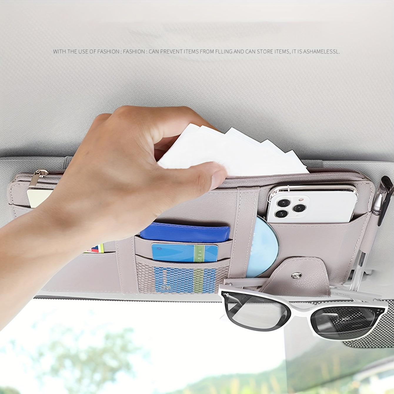 Stylish visor organizer with compartments for glasses, CDs, smartphones, wallets, and cards. Durable and compact design.