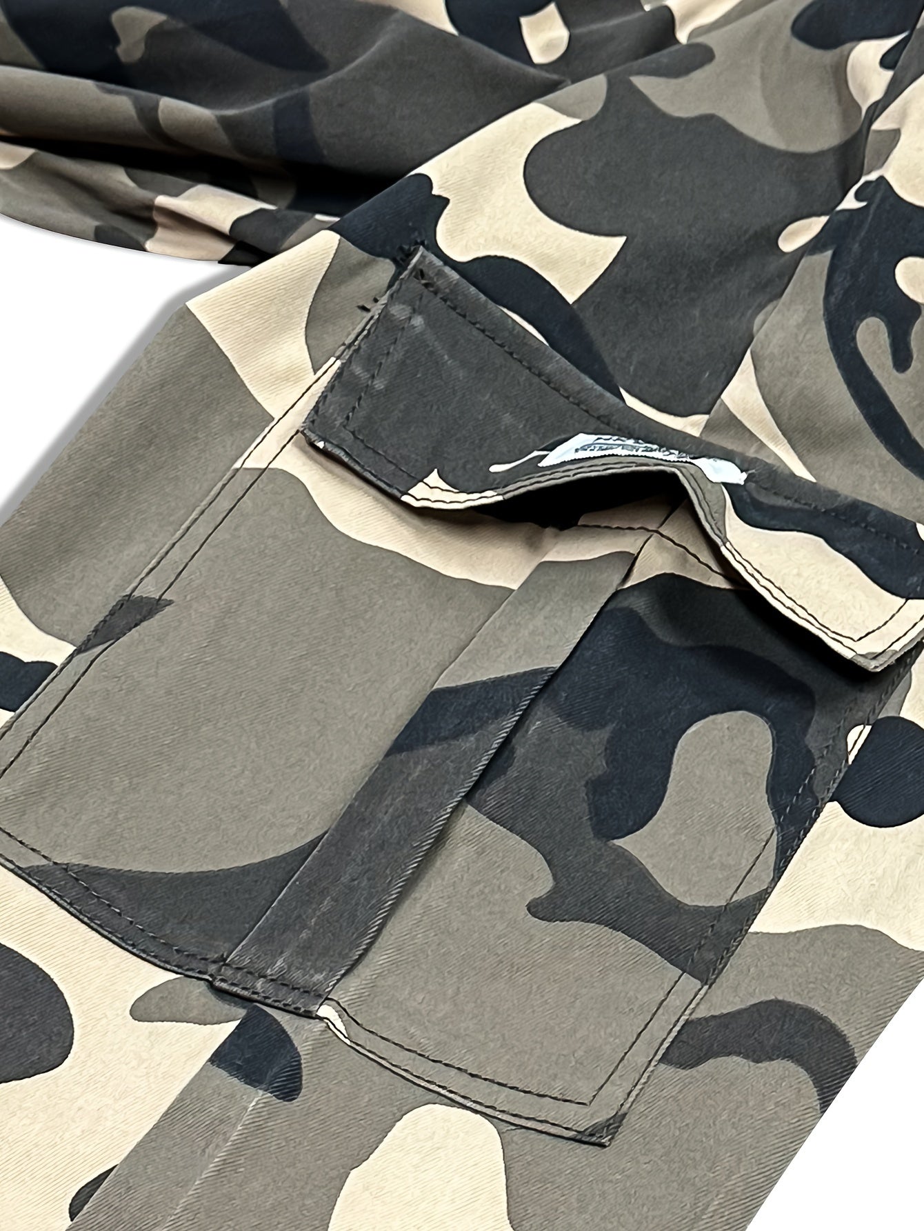 Men's camo cargo pants made from 100% non-stretch polyester fabric with a drawstring waist and flap pockets. Suitable for outdoor work.