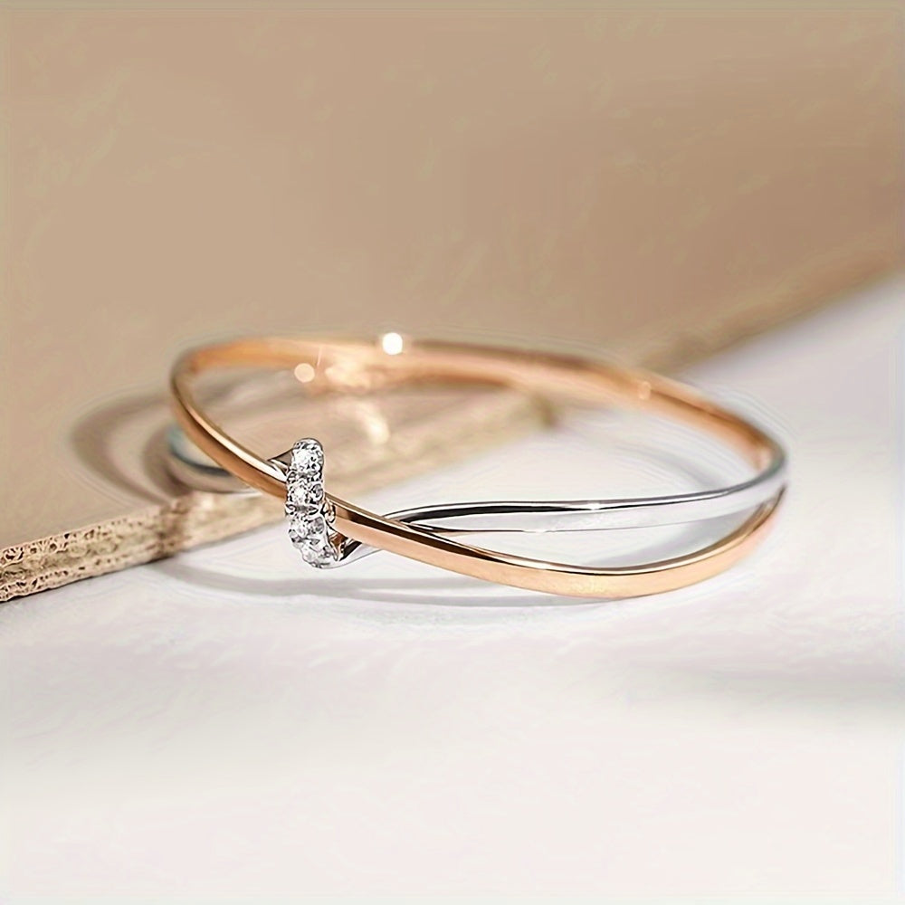 Rose Gold Double Knot Ring - This exquisite ring features elegant rose gold intertwined in a double knot design, crafted with 925 sterling silver and embellished with sparkling cubic zirconia stones. Perfect for celebrating your anniversary, this 2.0g