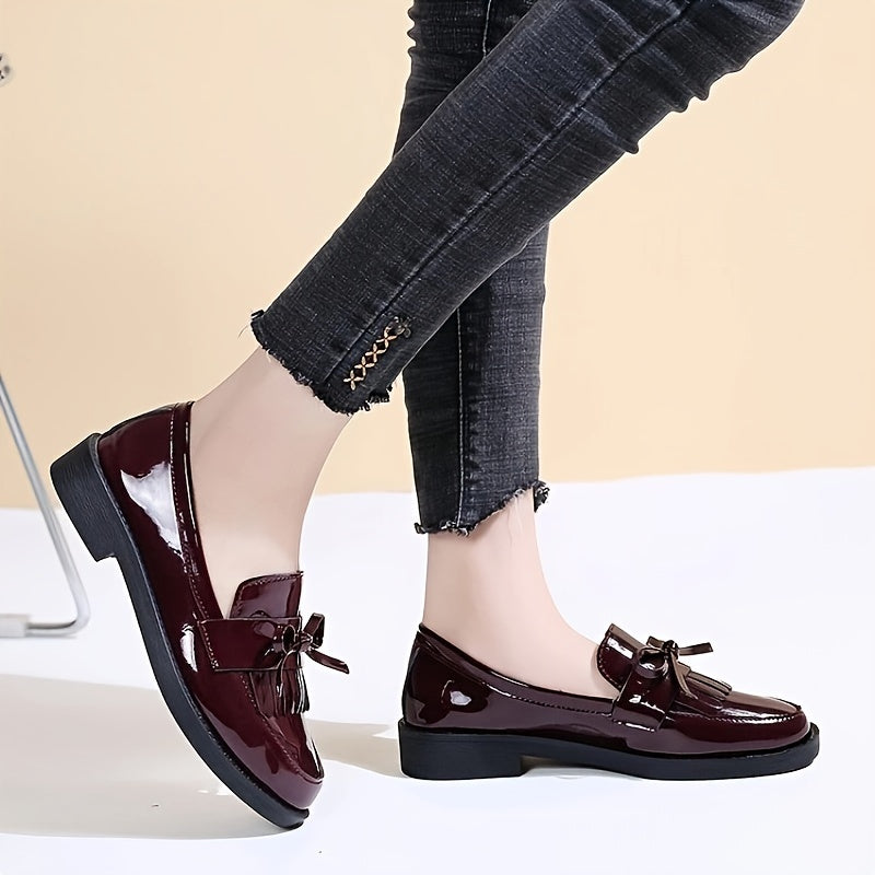 Women's slip-on shoes with preppy English style, solid color, round toe, and bow embellishment. Made of man-made materials with PVC insole and fabric inner material. Hand wash only.