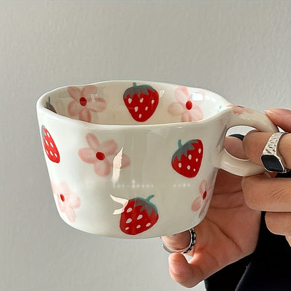 Unique hand-painted ceramic mug with a charming strawberry and floral design, perfect for coffee or tea. Ideal Valentine's Day gift, reusable and high-quality, featuring an irregular art style.