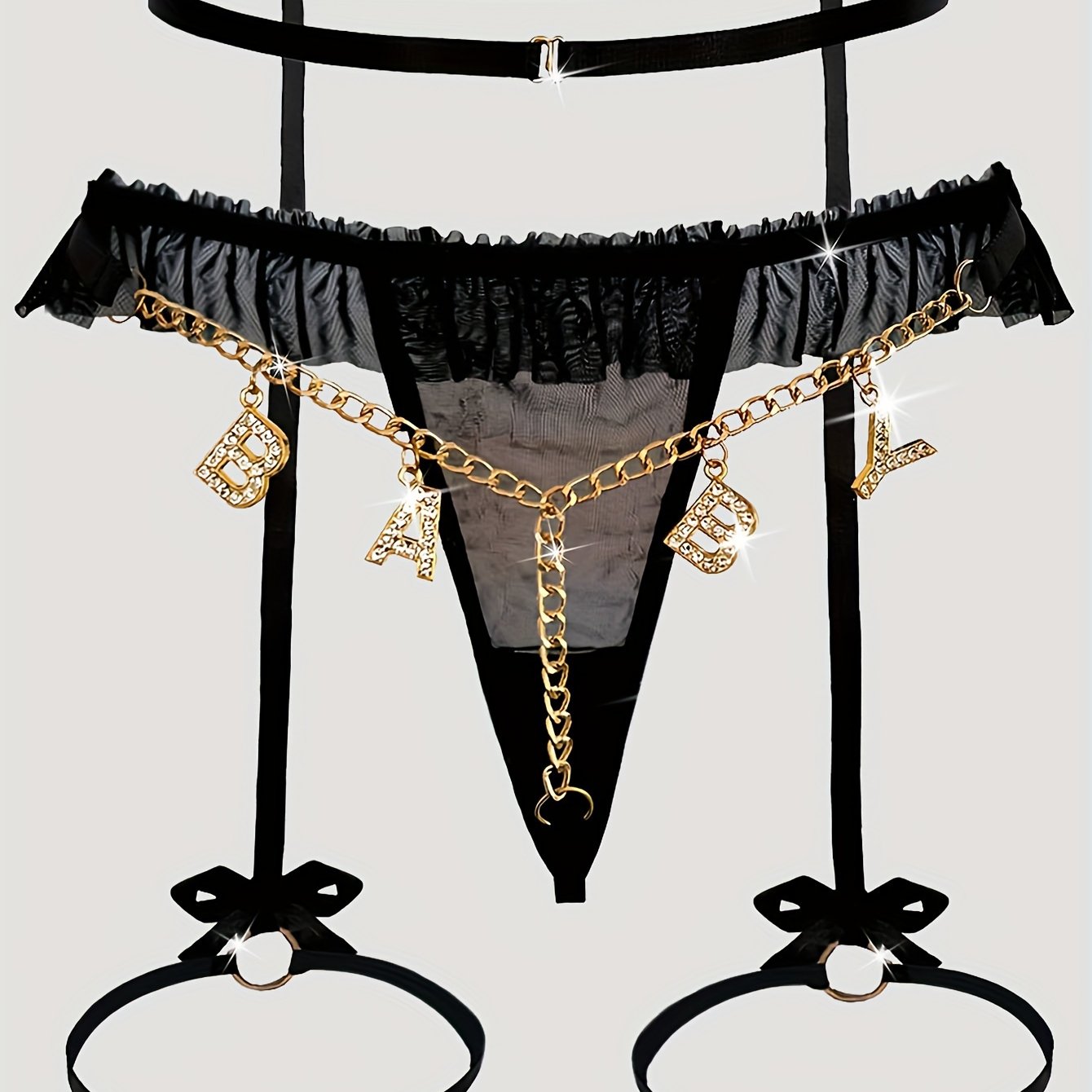 Seductive mesh garter set with gold chain, bow, and letter T-back.