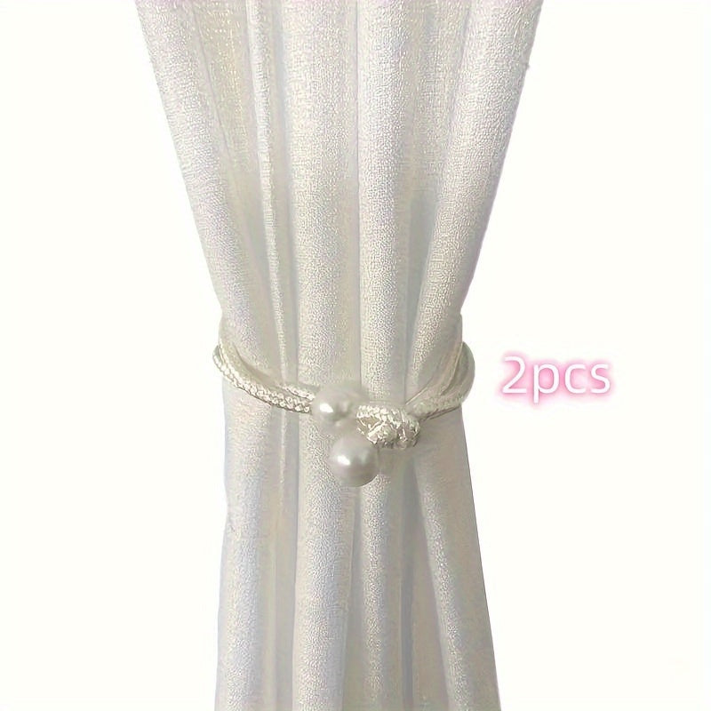 Fashionable and simple curtain binding rope available in 1 piece or 2 pieces. This decorative rope features creative pearl accents, adding beauty to your curtains. Use it as a decorative curtain buckle or binding strap for a simple and elegant touch.