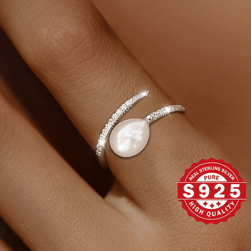 This elegant freshwater pearl ring for women is crafted from S925 sterling silver and adorned with artificial zirconia and freshwater pearls. Its stylish clash design makes it a unique gift option for festivals. Suitable for all occasions, this