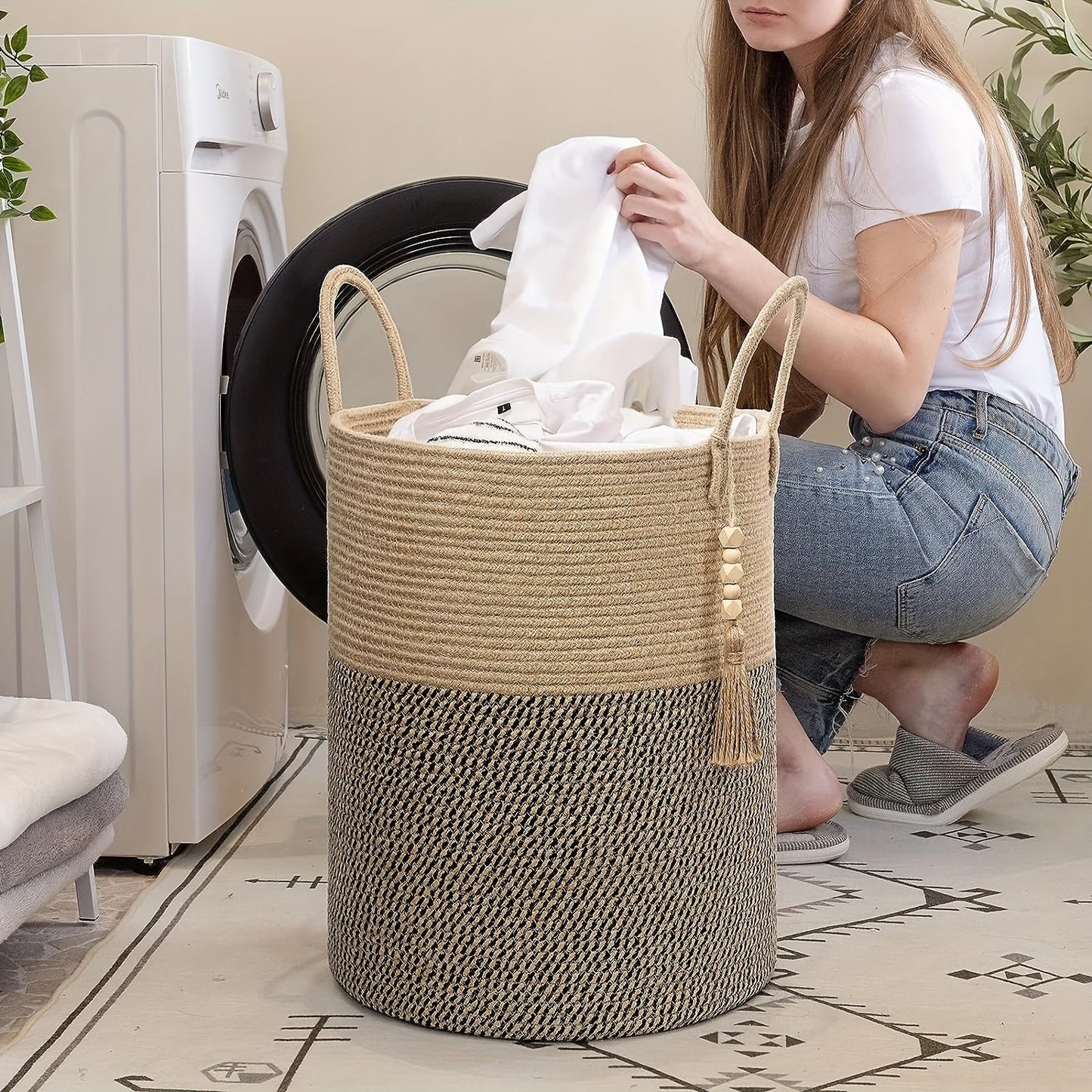 This tall laundry basket measures 40.64cm X 50.8cm and features a woven design with a convenient handle. It can be used as a blanket organizer in the living room, a storage basket for dog toys, or a decorative jute laundry hamper for clothes, pillows