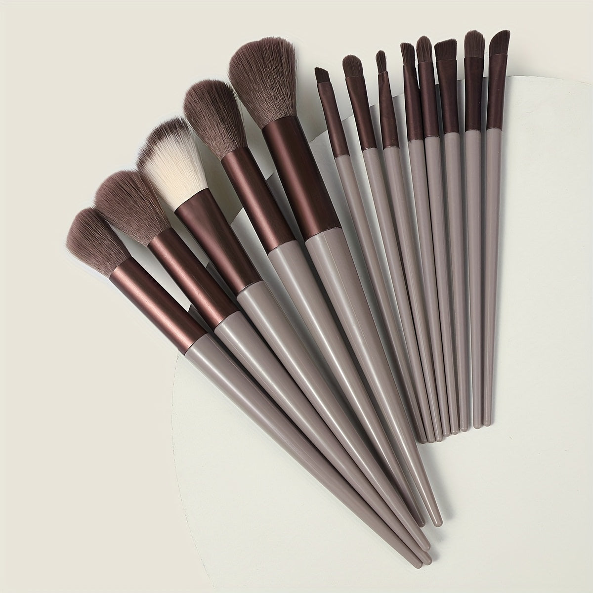 13-piece Makeup Brush Set with ultra soft, quick-dry bristles and matching fabric storage bag. Ideal for beauty enthusiasts.