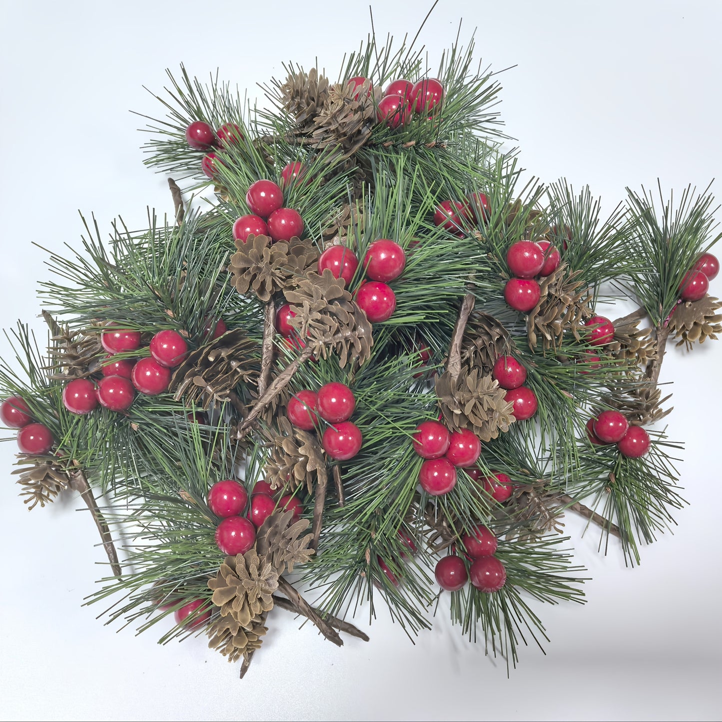 24 artificial pine picks with red berries and pinecones, perfect for DIY wreaths and seasonal decor.