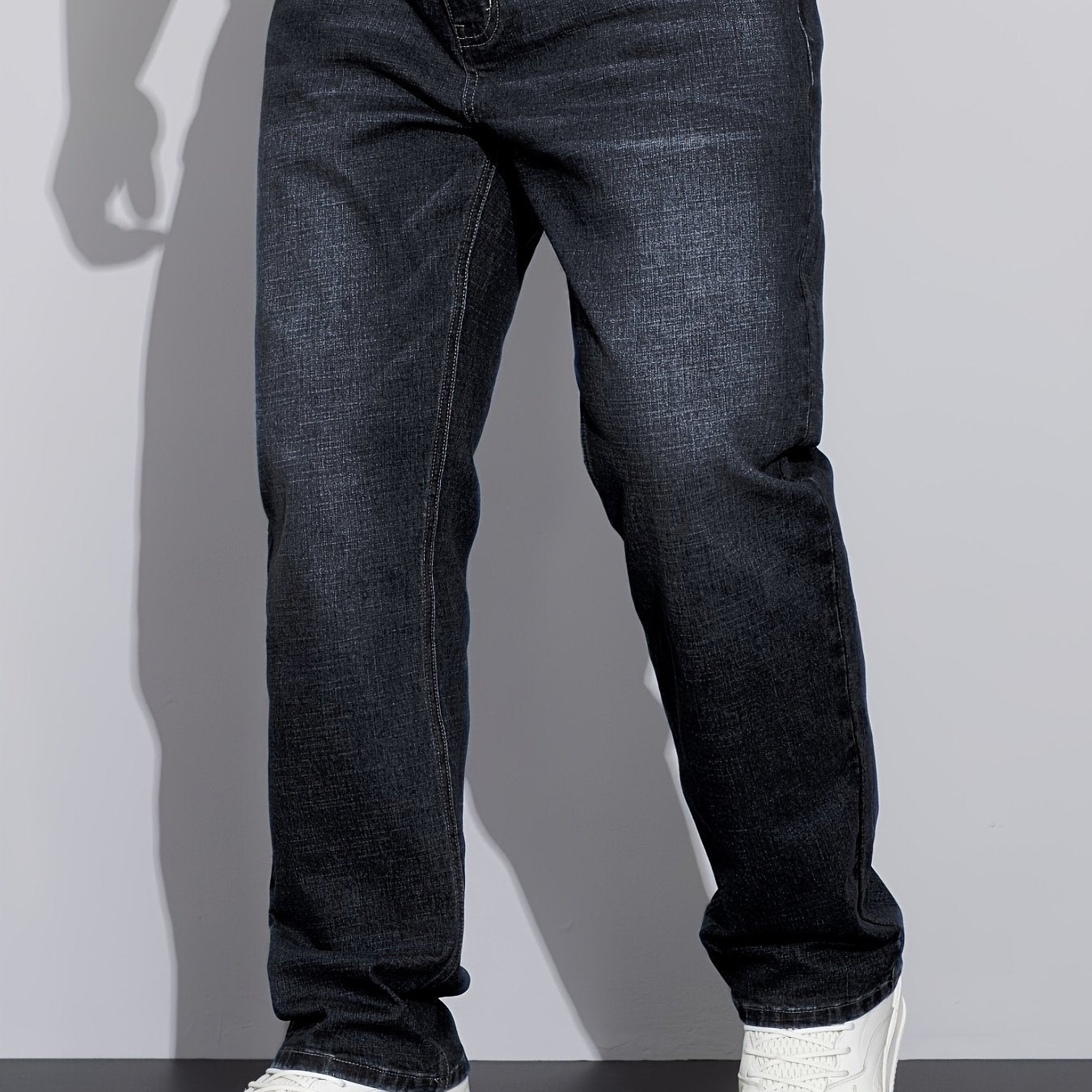 Men's stretchy cotton denim pants for all seasons, in a loose fit and plus size, perfect for business casual wear.