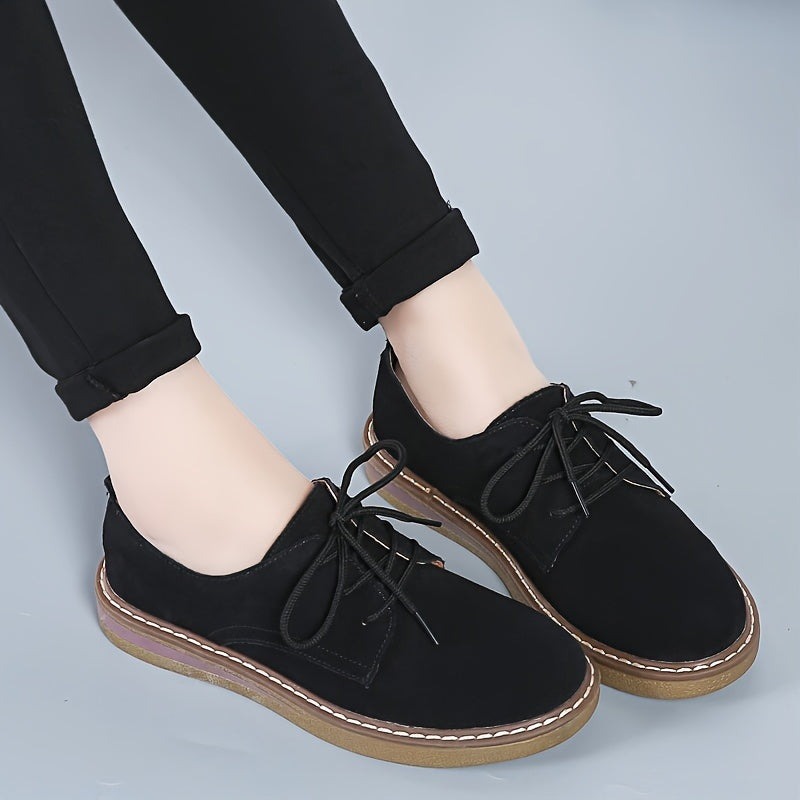 Women's flat, lace-up loafers in solid color, perfect for back to school with a comfortable preppy style.