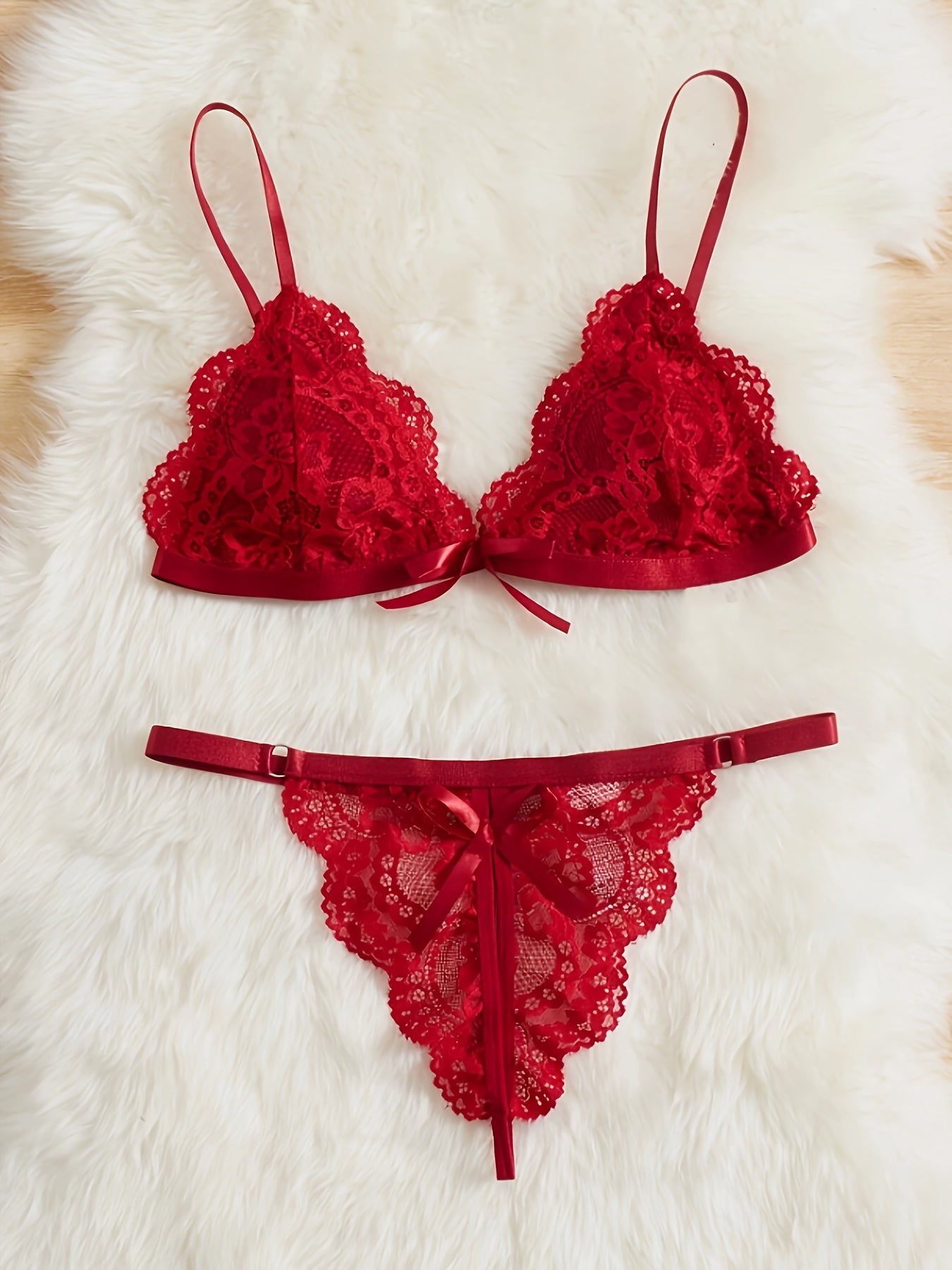 A women's lace lingerie set with a hollow design, open-crotch style, sexy bow detail, non-transparent bra, triangle cup shape, and Y2K style.