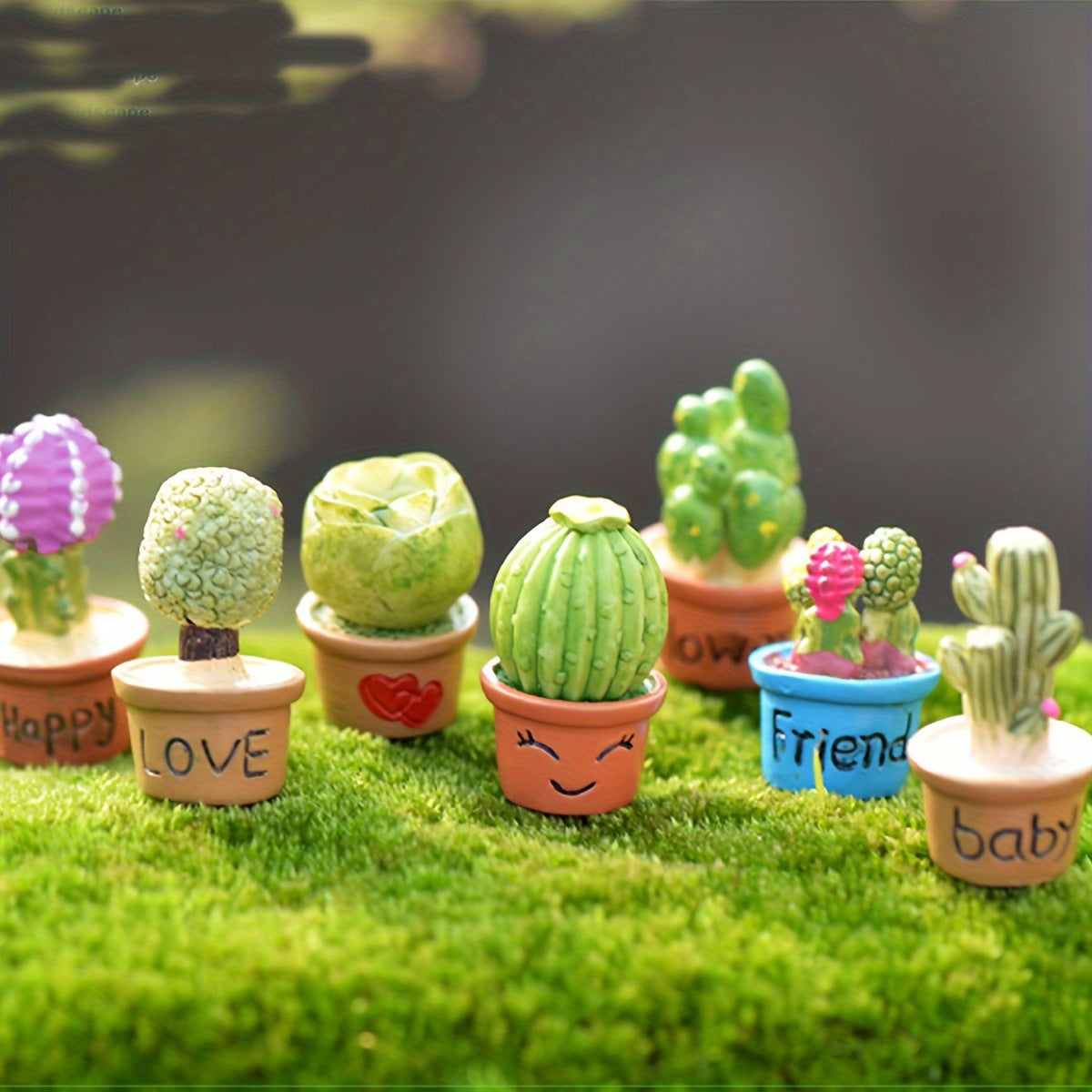 Miniature succulent and cactus fairy garden set with resin ornaments, ideal for small landscapes, desks, cakes, and gardens.