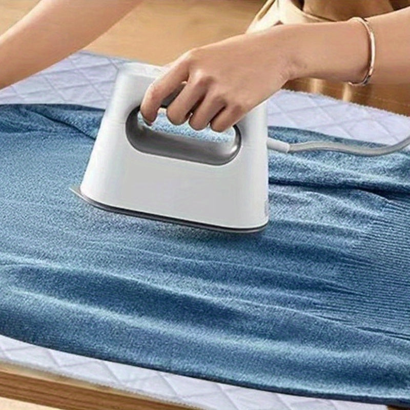 1 piece of a portable folding ironing mat with thick cotton padding, heat-resistant material, ideal for travel and dorm laundry. Non-electric tabletop pad suitable for dryers, washing machines, and all surfaces.